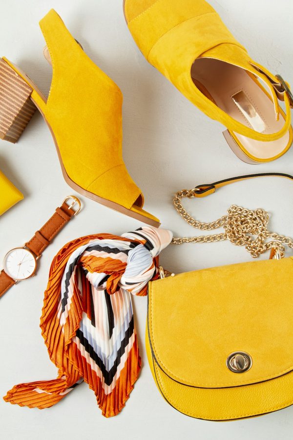 Flat lay with woman fashion accessories in yellow colors. Fashion blog, summer style, shopping and